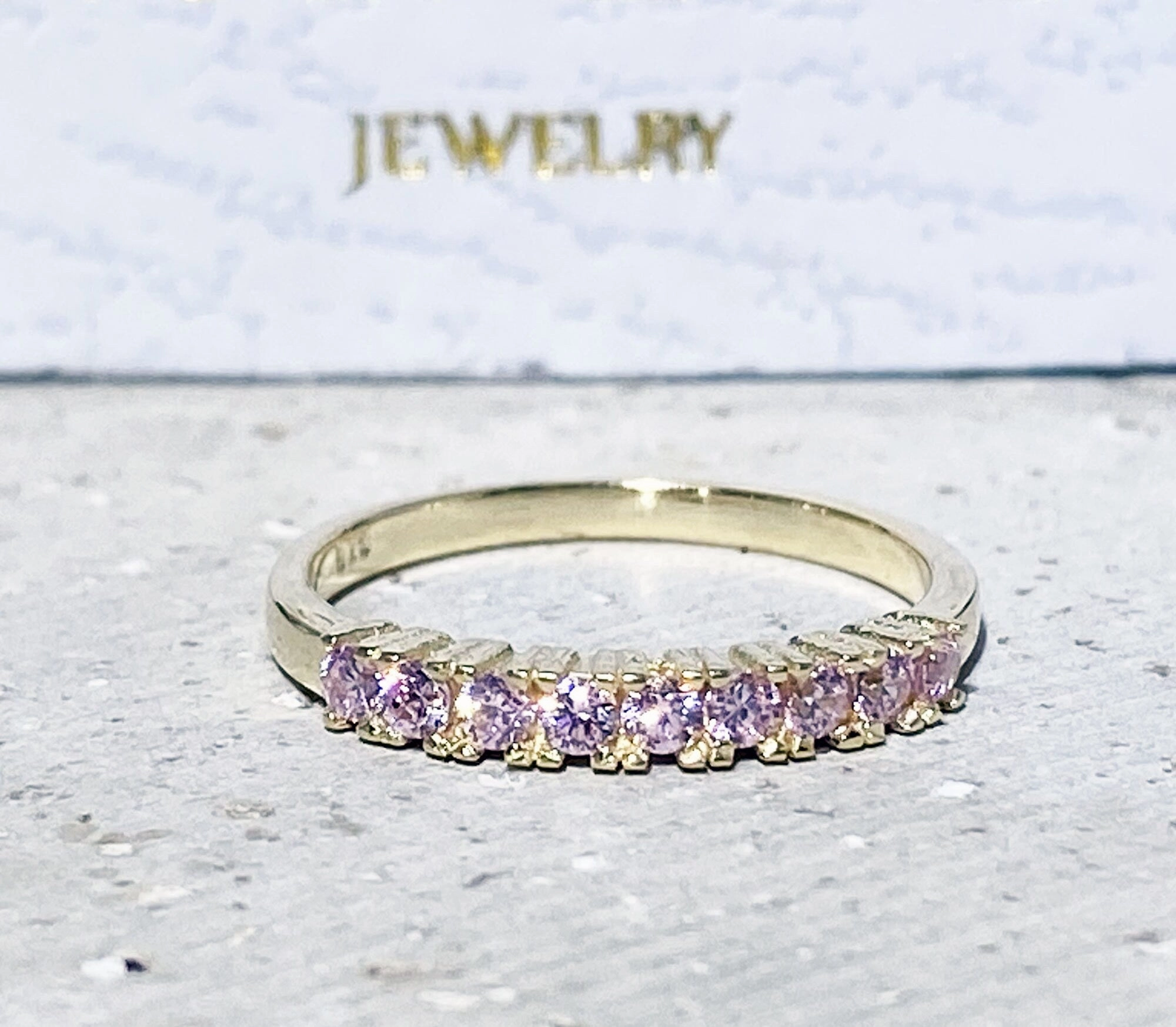 October Birthstone Round Rose Quartz Nine-Stone Half Eternity Ring
